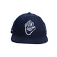 Front-facing view of the Marty Baptist x FallenBROKENstreet Miracle Eye Cap in navy. Features a wool felt structured build and embroidered Miracle Eye artwork on the crown. Designed as a limited edition release with only 50 units available in each size. A bold artist collaboration showcasing wearable street art.

