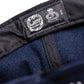 Zoom on sizing tag with embroidered size markers. Highlights the premium craftsmanship and branding details of this limited-run cap.

