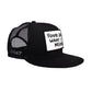 Side profile of black Marty Baptist trucker cap showing patch and mesh detail

