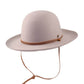 A beige colored kid's hat made of Australian wool felt, featuring a cotton inner band with an adjustable feature and a drawstring.