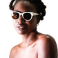 Female model wearing NYX White on Black sunglasses, looking to the side

