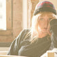 Model wearing The New Yorker Cap – Red Tartan by FallenBROKENstreet. Classic red plaid hat with a refined fit and modern silhouette.