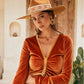 Side profile of model adjusting brim of FBS x Nine Lives Bazaar hat, styled for festival or summer boho look

