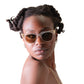Model wearing NYX Skywalker sunglasses – clear frame, gold detailing, bronze lenses

