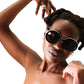 portrait of model in THE ORBIT round sunglasses with white acetate arms 


