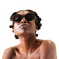 Side profile of woman in THE ORBIT – Stardust sunglasses, gazing upwards confidently
