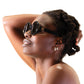 Woman reclining with hands behind head, wearing THE ORBIT – Stardust round sunglasses