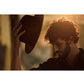 Model wears fallenbrokenstreet packable brown fedora in golden light