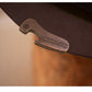 Brown leather knife with engraving on a blurred background
