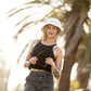 Model wearing FBS x Reality reversible recycled hat

