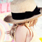 Kids River Straw Hat, woven straw design with velvet bow band and 53.5cm fit.