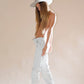 Lifestyle image of Ruby Felt Hat – Sage by FBS x Ruby Tuesday Matthews. Structured wool felt hat with wide brim, ribbon band, and UPF 50+ protection. Model styled in white jeans against a pale backdrop, emphasising the hat’s sage colourway and dramatic silhouette.