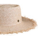 Side profile of The Seeker Straw Hat showing the textural raffia weave, frayed edge, and subtle elevation with its handcrafted detailing.