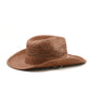 angled back view of FallenBROKENstreet Sun Chaser Hat – Chocolate, raffia straw cowboy hat with leather inner band.