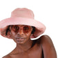 Model smiling in pink cotton corduroy hat by FallenBROKENstreet, styled with round sunglasses for an easy, vintage-inspired warm-weather look.

