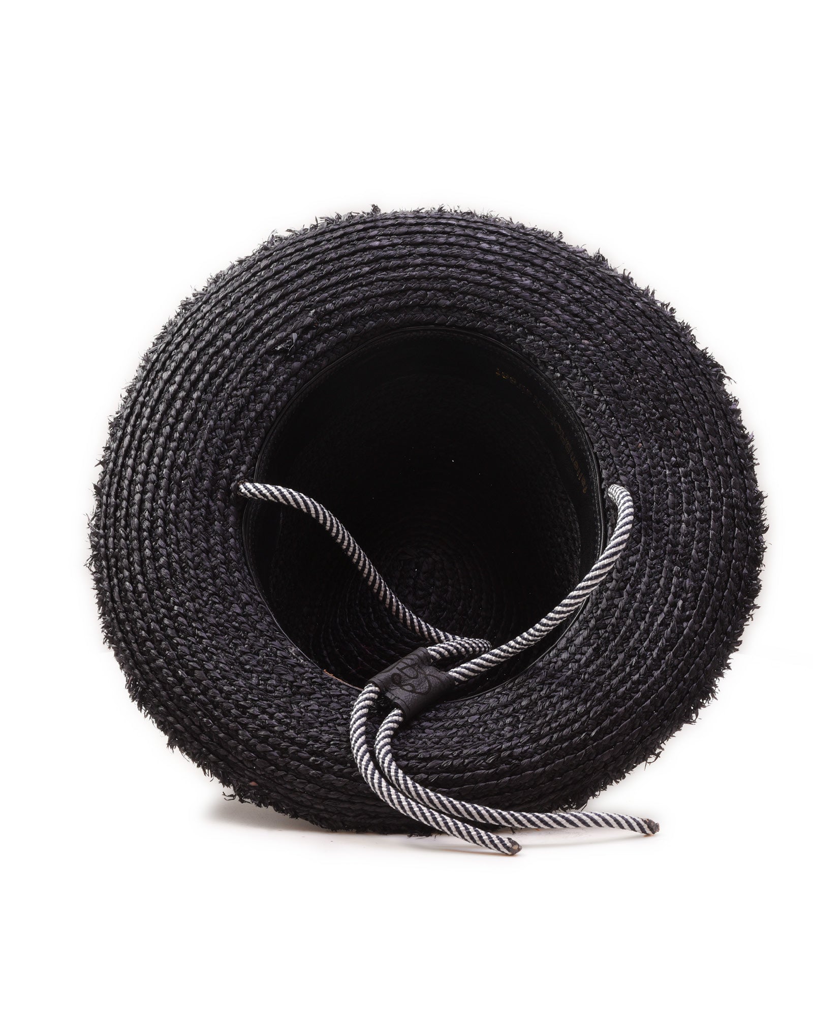 Bottom view of FallenBROKENstreet Outrider Straw Hat – Black Raffia with frayed brim and cord tie.