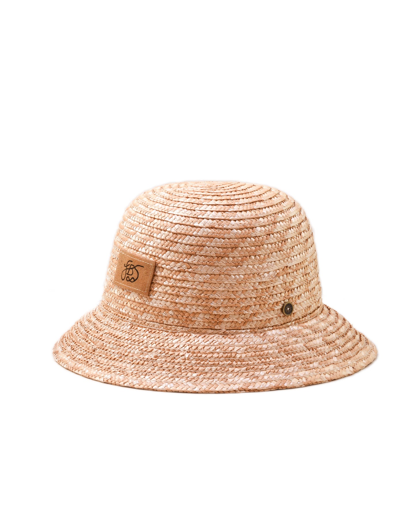 Beige straw bucket hat with a brown label on a white background