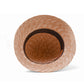 Inside of straw bucket hat by fallenbrokenstreet with a brown leather patch on a white background 