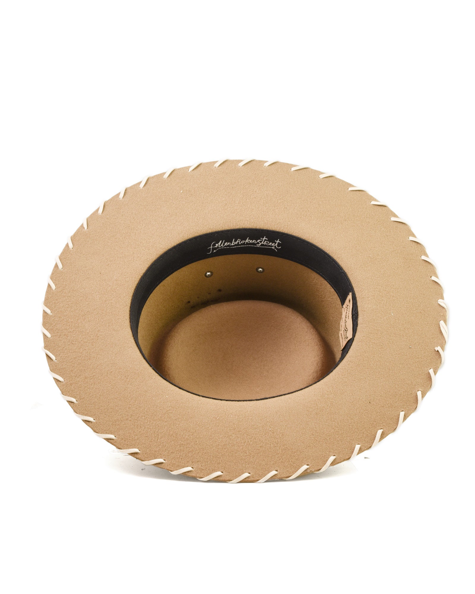 inside view FallenBROKENstreet Pathfinder Felt Hat shown in camel wool felt. This wide brim hat includes whipstitch edge detail, structured crown, ventilation eyelets, and grosgrain ribbon band. A unisex felt design offering UPF 50+ protection and signature detailing, built for adventure and refined outback style. Crafted for both men and women seeking timeless felt headwear.
