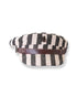 A black and white striped cap with a 5cm brim, canvas upper, metal ship detail, and leather inner band.
