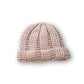 The Transcend Classic Beanie beige worn beanie showing above-ear fit and structured fisherman silhouette
