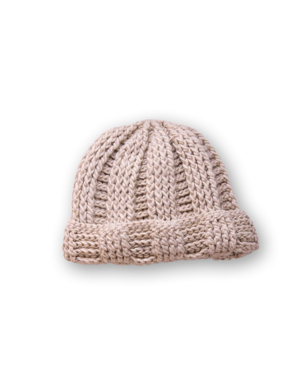 The Transcend Classic Beanie beige worn beanie showing above-ear fit and structured fisherman silhouette
