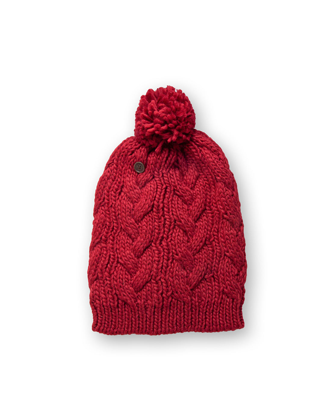 • The Consciousness Beanie red close-up showing cable knit pattern and pom detail with soft fibres
