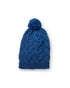 Blue knitted beanie with a pom-pom on a white background