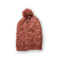 The Consciousness Beanie orange marle worn beanie showing comfortable stretch fit and cosy cable knit construction