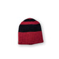 The Wally Beanie red black product shot on neutral background showing short shape and strong colour contrast