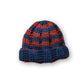 The Transcend Stripes Beanie blue red product shot on neutral background showing compact shape and colour contrast