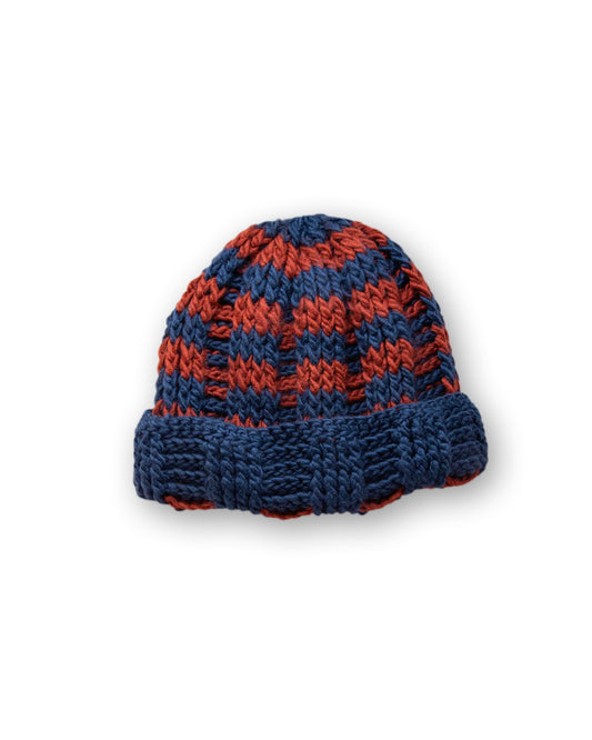 The Transcend Stripes Beanie blue red product shot on neutral background showing compact shape and colour contrast