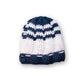 he Transcend Classic Beanie navy white product shot on neutral background showing compact shape and classic tones