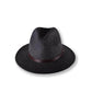 Dark gray fedora hat with a brown band on a white background