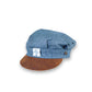 Blue cap with brown visor on a white background