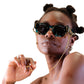 Model wears FallenBROKENstreet’s Button Chain – Gold, styled with black sunglasses and natural hair. The 24k gold-plated chain hangs elegantly from each temple, highlighting its signature button and lobster clasp details. Perfect accessory for those who value fashion and practicality. Ideal for use with all Fallenbrokenstreet sunglasses.

