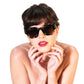 Close-up of model styling The Cosmos shades in a playful, editorial pose. Perfect for conveying emotion, texture, and brand identity on a product detail page.