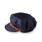 side view of denim cap on white background
