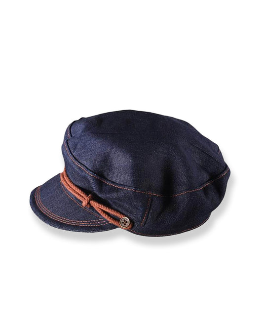 side view of denim cap on white background
