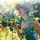Model in nature wearing the wide brimmed brown straw hat by Fallenbrokenstreet. A perfect blend of relaxed elegance and earthy femininity in natural light.

