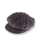 Dark gray corduroy cap on a white background