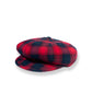 Red and black plaid beret on a white background