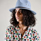 Woman wearing a babyblue felt hat