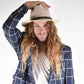 Man looking forward wearing wool felt hat in a cream colour