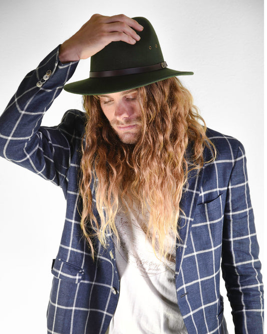 Man in a forest green wool felt hat