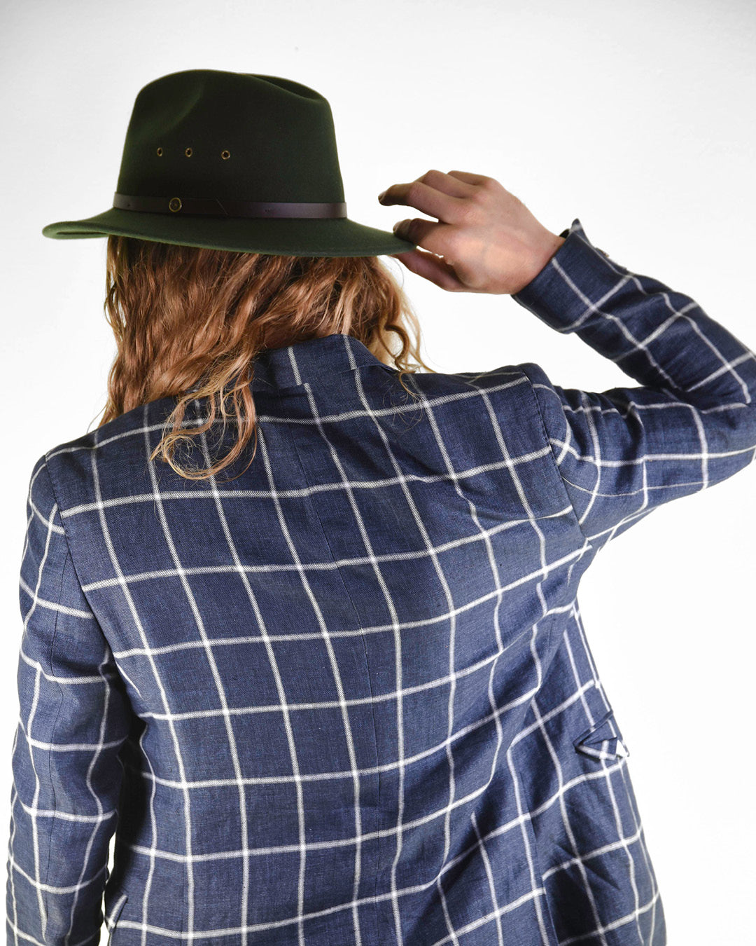 back view of man in fallenbrokenstreet hat