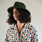woman in a forest green wool felt hat
