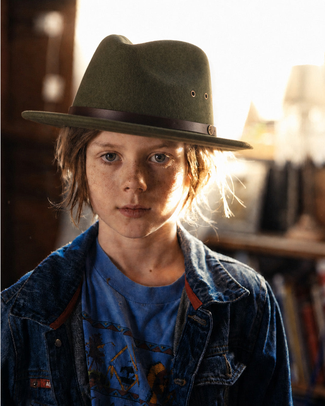 Boy wearing a green felt fedora by fallenbrokenstreet