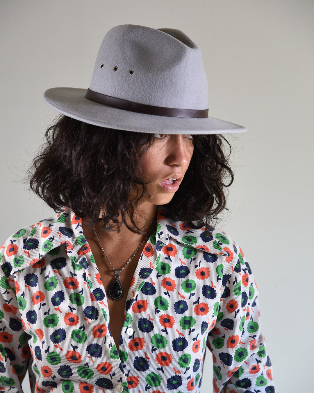  side view of woman wearing a Ratatat Felt Hat Grey studio product shot Australian wool felt classic grey shade
