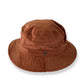 A brown bucket hat made of cotton corduroy with a button detail on the crown.